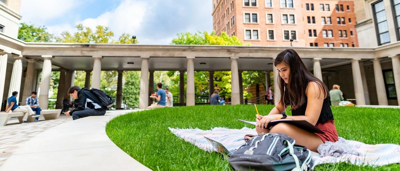 students in the quad studying on the oakland campus