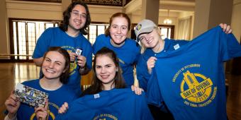 five people pose for a photo on pitt's day of giving