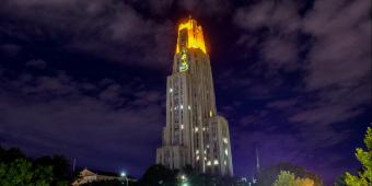 cathedral of learning at night with the victory lights on