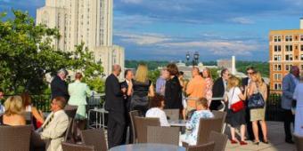 guests chat on the terrace at the university club